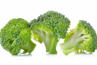 fresh broccoli isolated on white background .