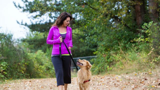 woman walking with dog