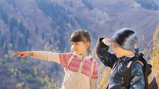 Portrait of hiking caucasian boy and girl