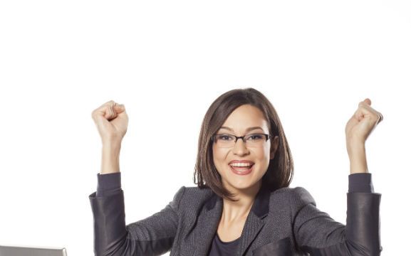 happy young businesswoman with the winning gesture