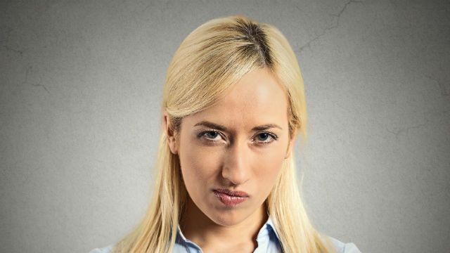 Headshot pissed off, angry, grumpy, young woman