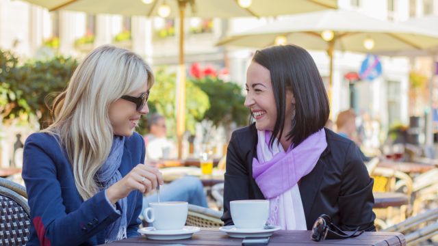 Two female friends meeting for a coffee