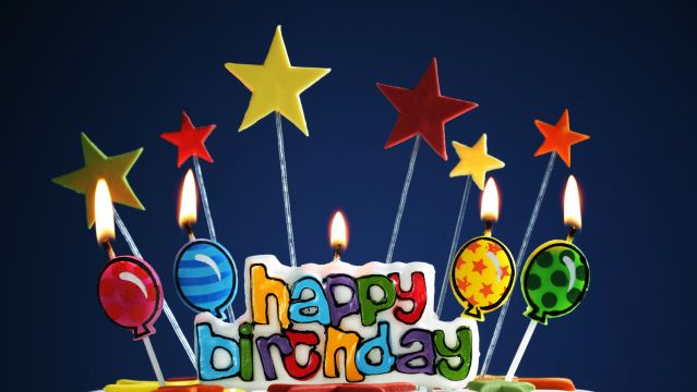 Happy birthday candles on a cake
