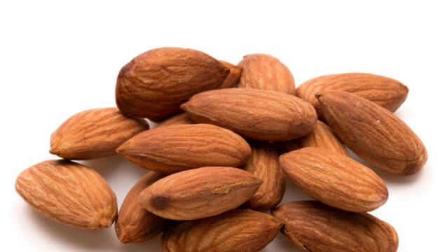 almond nuts isolated on white background close up
