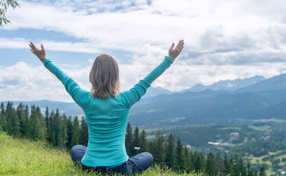 Woman Meditate at the Mountains