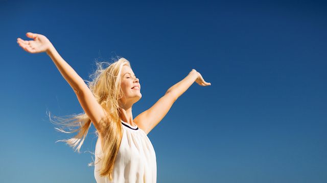 beautiful woman enjoying summer outdoors