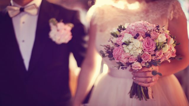 Bride holding her wedding bouquet in the church
