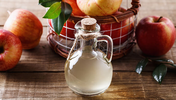 Treating skin tags with apple cider vinegar is an effective at-home remedy.