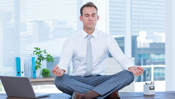 Doing yoga at your desk can keep you calm and happy.
