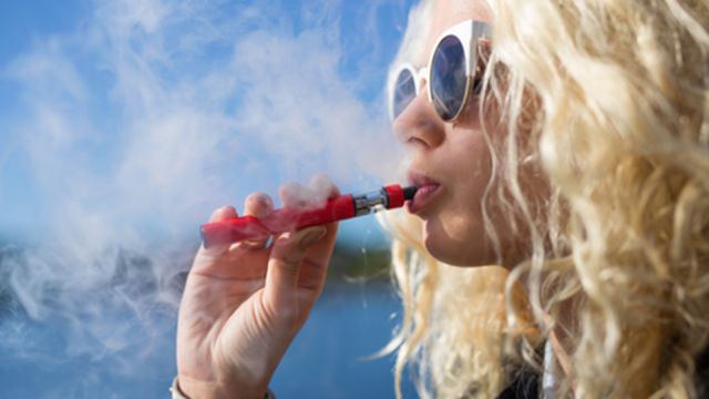Woman smoking e-cigarette