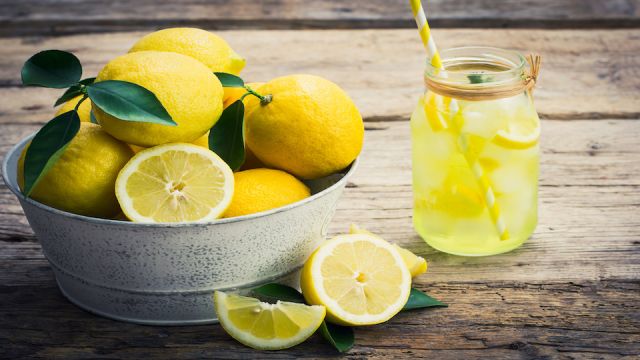 Fresh lemons and lemonade