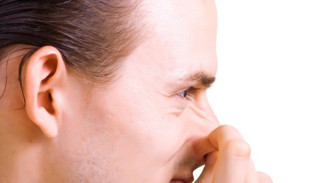 men has thrust a finger in the nose