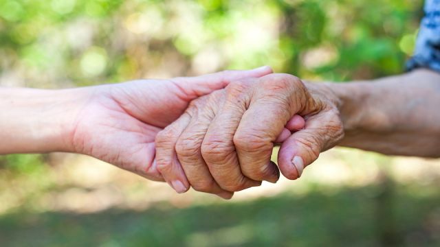 Shaking elderly hand