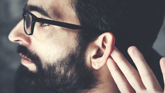 man hand in ear