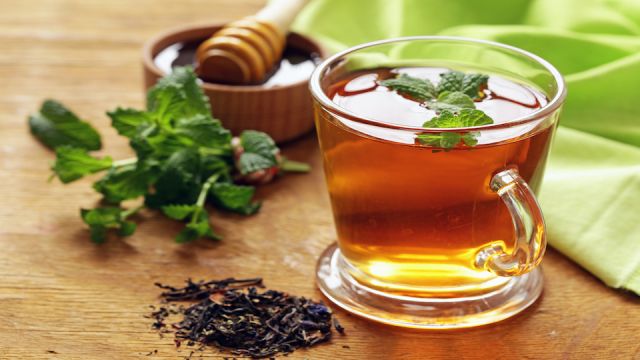 Mint flavored tea in a glass cup
