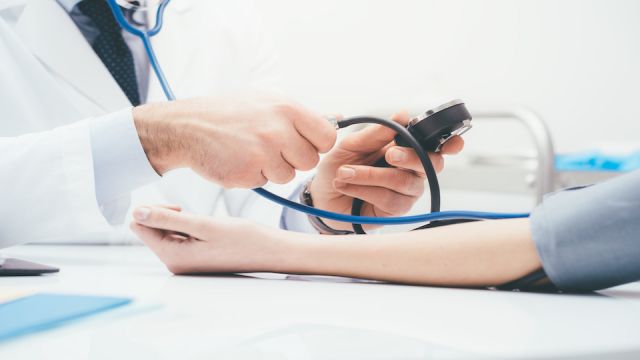 Doctor measuring pressure