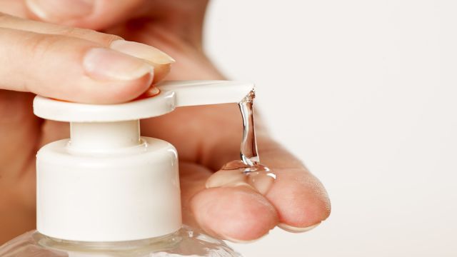 putting sanitizer on hand from the pump