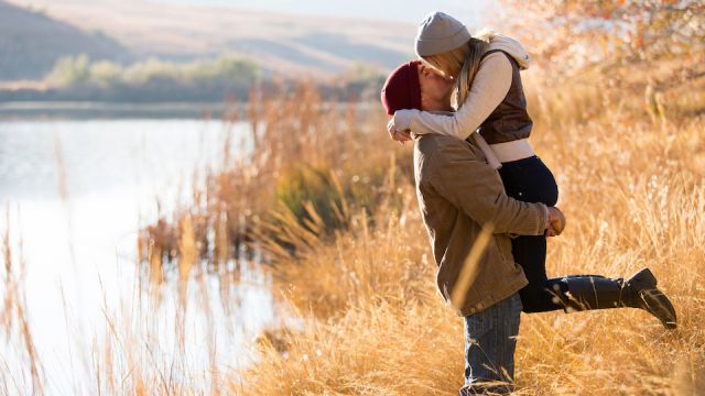 young couple kissing in autumn