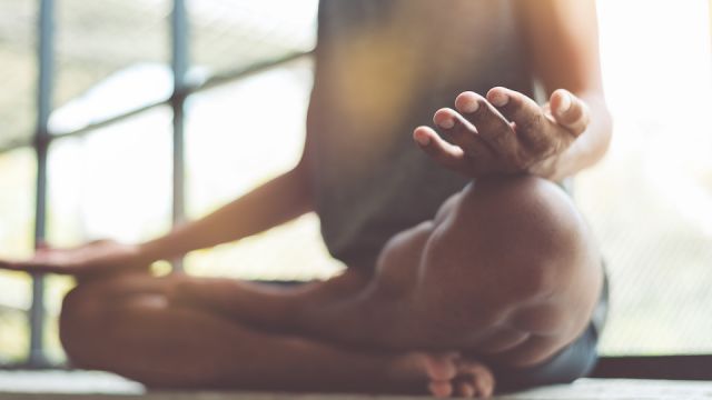 Young attractive boy exercising,asian man practicing meditation indoors, Yoga and Healthy lifestyle concept.