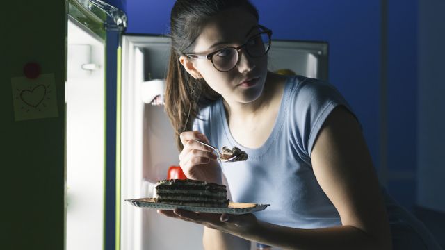 Woman having a late night snack