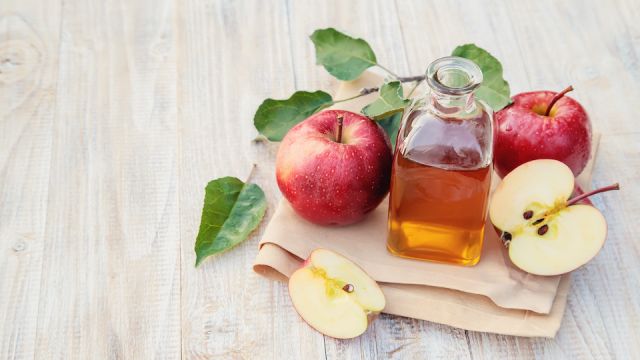 Apple cider vinegar in a bottle. Selective focus.