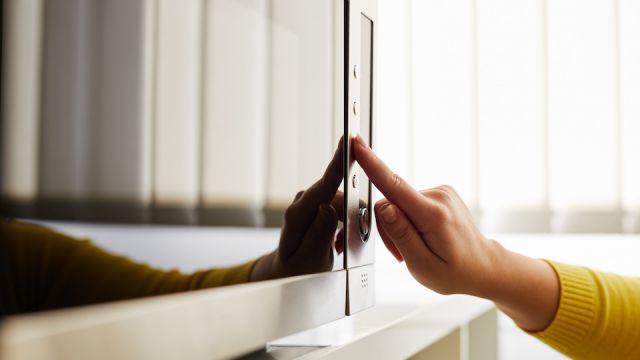 Woman using a microwave