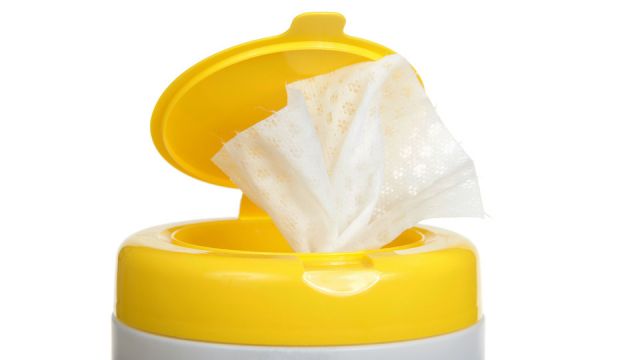 Close up on top of a pop up disinfecting wipes container, isolated on white.