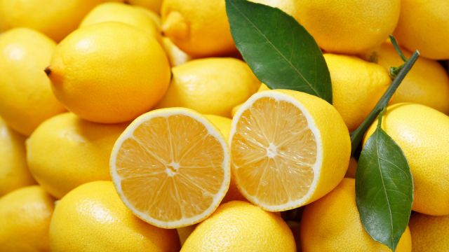 fresh lemons as background, top view