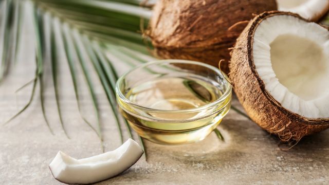 Bowl with coconut oil on table