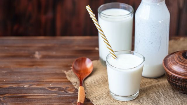 Homemade kefir, yogurt with probiotics in a glass on table Probiotic cold fermented dairy drink Trendy food and drink Copy space Rustic style.