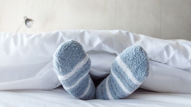 Female foot in warm Stripe wool sock
